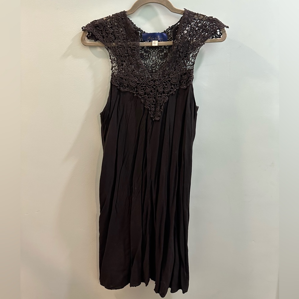 Cute dress with embellishments on neck and shoulder!